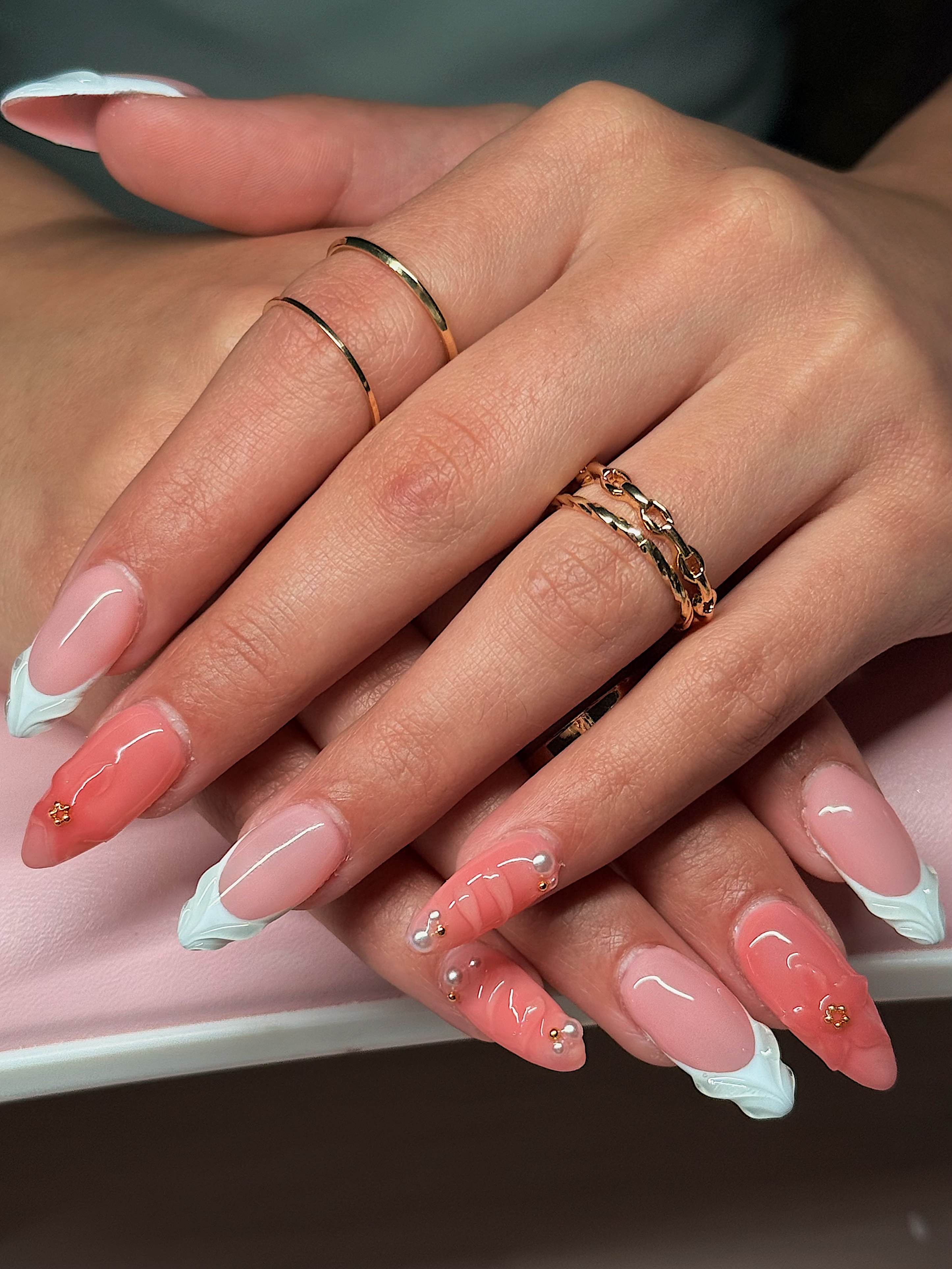 Summer textured nails with 3D flowers, French tips, and line accents